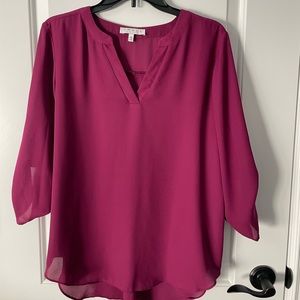 Flowy blouse in a pretty berry color.